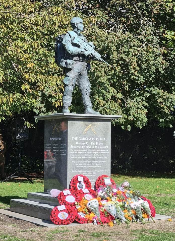 The Gurkha Memorial statue with floral wreaths at the Garden of Remembrance in Folkestone